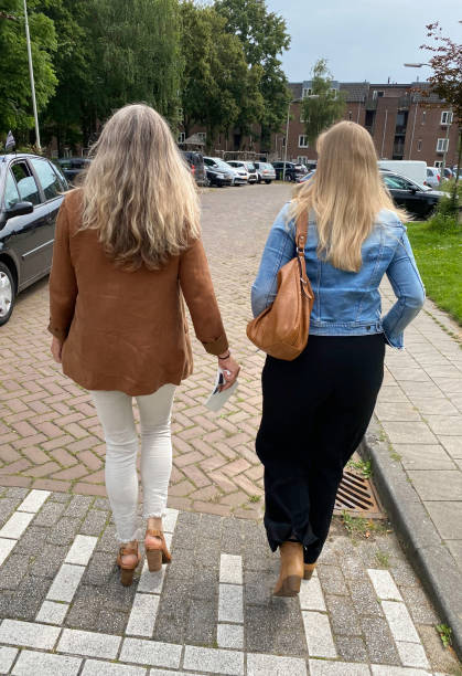istock Mother and Daughter at funeral 1411034502