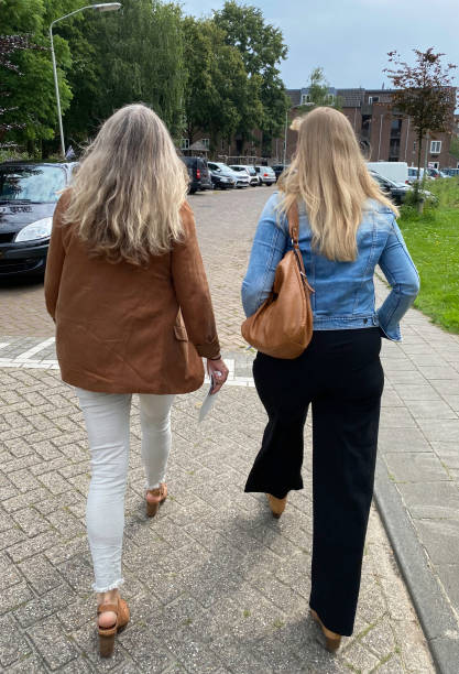 Mother and Daughter in rear view