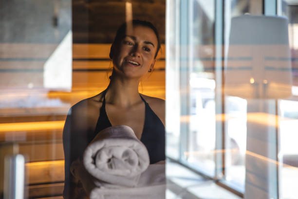 istock A young woman having rest in sauna alone. 1411034664
