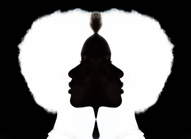 Close up portrait of african american woman with afro hairstyle on white studio background stock photo
