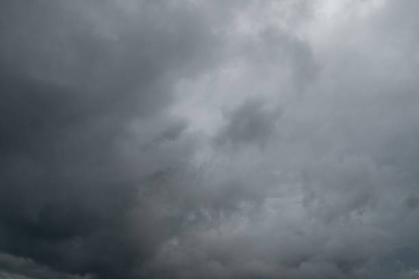istock Rainy tropical storm coming Gloomy dark cloudy sky, turbulent sea waves. Empty overcast beach just before the wild rainfall 1411035376