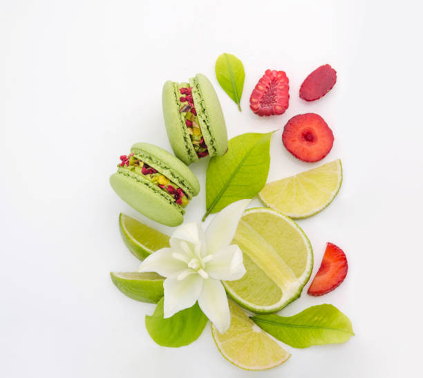 istock Green lime, colorful berries and flowers on a white background. 1411038786