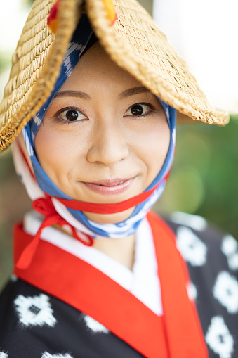 A young beautiful Japanese woman in traditional festival costume portrait.