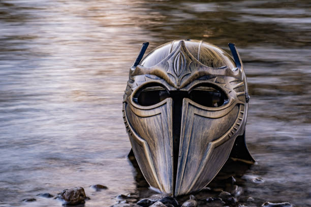 istock Metaphorical installation on a mountain river with a gladiatorial helmet 1411039990