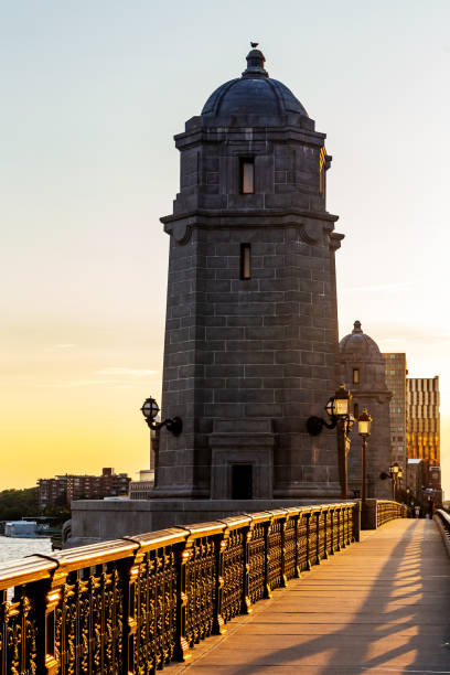 Sunset on the Longfellow Bridge tower and pedestrain sidewalk, looking towards Cambridge. Longfellow Bridge is a combination railway and highway bridge between Cambridge and Boston.