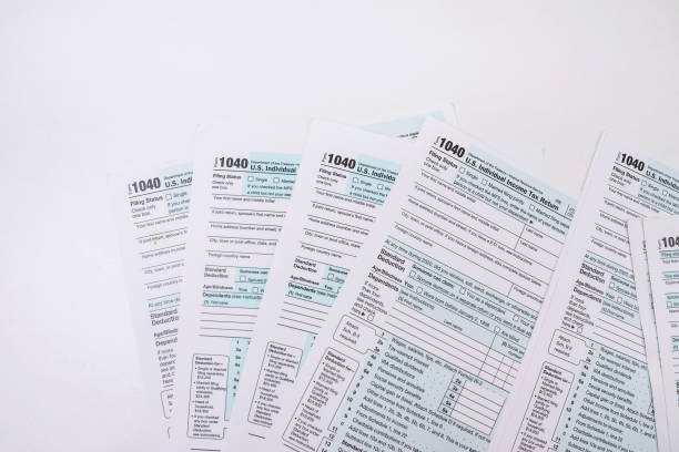 istock empty 1040 individual tax form ready to fill in office desk 1411040845