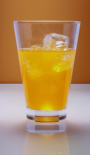 Fresh cocktail with grapefruits on the rustic background. Selective focus. Shallow depth of field.