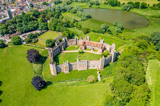 Framlingham Castle is a castle in the market town of Framlingham in Suffolk in England. An early motte and bailey or ringwork Norman castle was built on the Framlingham site by 1148, but this was destroyed by Henry II of England in the aftermath of the Revolt of 1173–1174. Also know for being the 'Castle on the Hill' that Ed Sheeran sings about.
