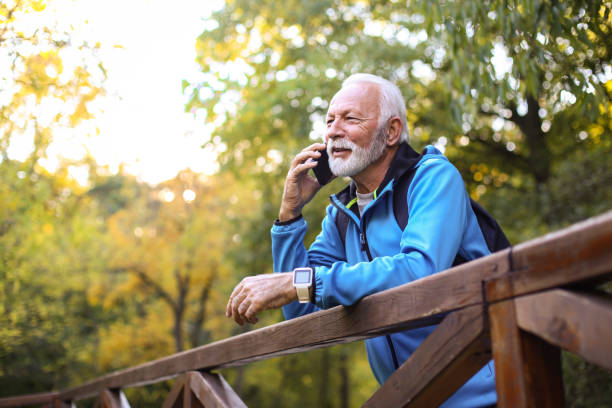 istock Senior man talking on phone 1411048024