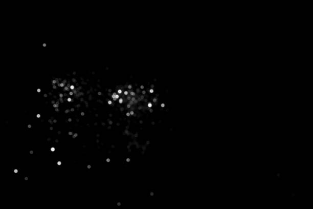 istock White gray blurred bokeh lights on black background 1411050681