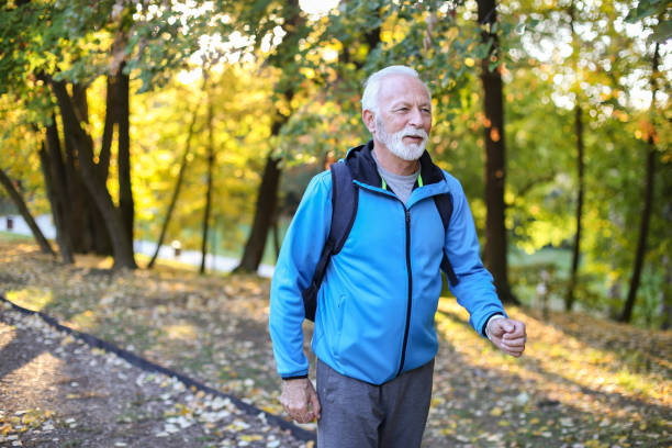 istock Senior man walking in nature 1411050782