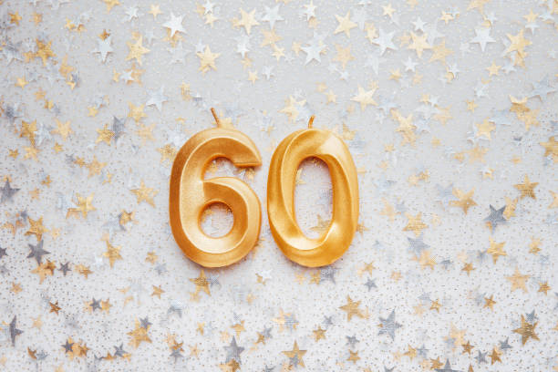 istock Number 60 sixty golden celebration birthday candle on Festive Background. 1411052425