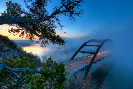 The Pennybacker Bridge over Lake Austin in morning fog, Austin, TX.