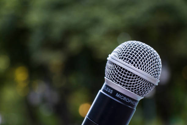 istock Microphone close-up, outdoor background 1411057142