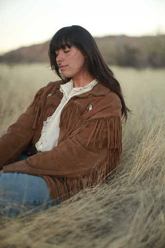 Bohemian Free Spirit styled fashion images in a grassy desert area.