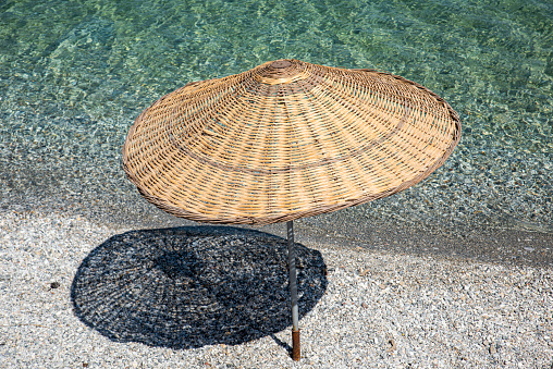 A wicker sunshade on the beach