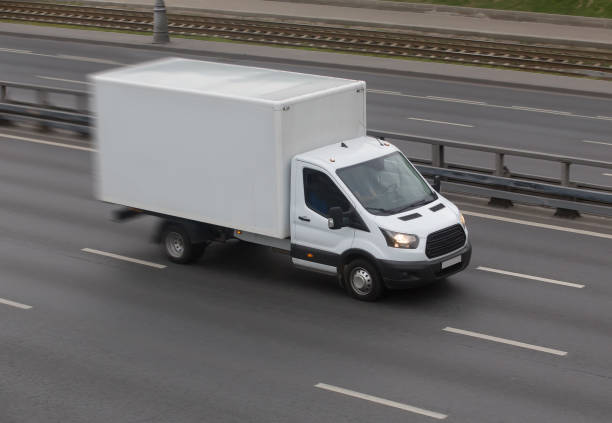 istock Truck moves on a multi-lane highway 1411060339