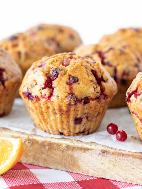 istock Cranberry orange muffin on a wooden table with white background 1411062227