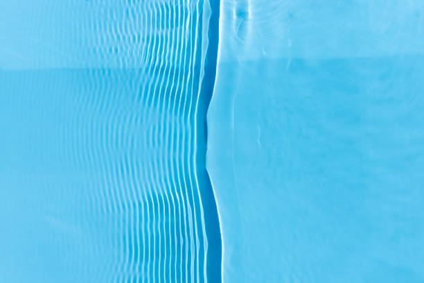 istock Abstract background of blue water under sunlight. Top view, flat lay 1411069644