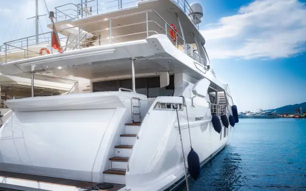 Photo of Architectural detail of a brand new superyacht, with guest cabin windows and bridge