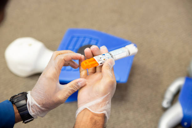 Staff training to inject an epinephrine as first aid Staff is training to inject an epinephrine as first aid. adrenaline stock pictures, royalty-free photos & images