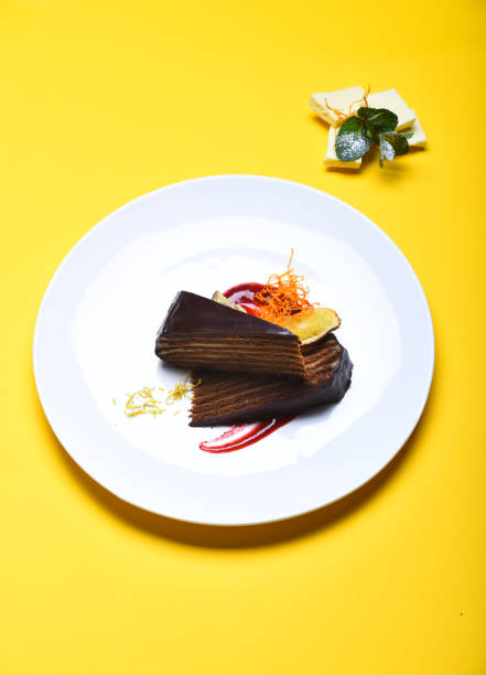 istock Prague chocolate cake on plate on yellow background. 1411075962