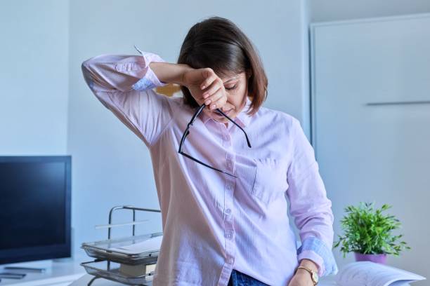 istock Mature tired woman experiencing stress headache depression 1411076490