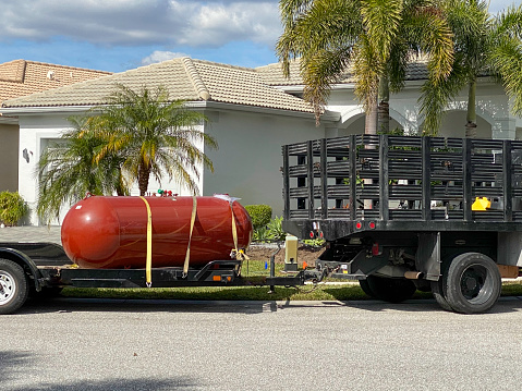 Propane tank for an underground auxiliary generator waiting to be installed underground at a home.