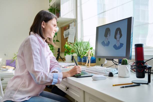 istock Young female graphic designer drawing sketch on graphics tablet 1411078136