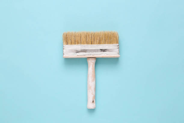 istock Paint brush on a light blue background. Minimalism 1411078758