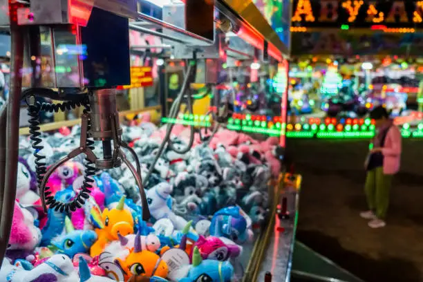 Fairground attraction catching stuffed toys