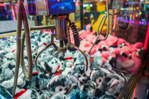 istock Fairground attraction catching stuffed toys 1411079781