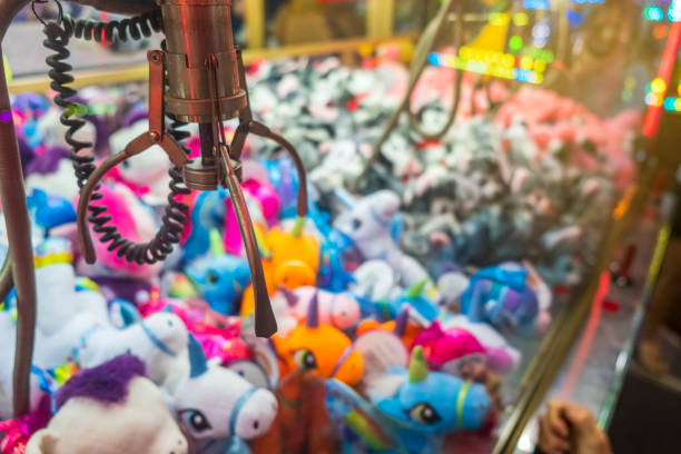 istock Fairground attraction catching stuffed toys 1411079790