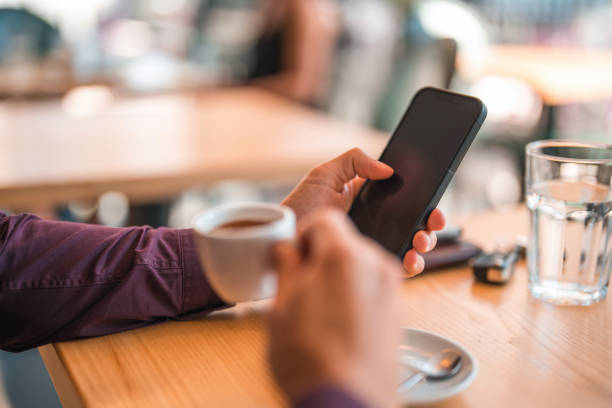 istock Young Businessman Working With His Smart Phone And Watch 1411083589