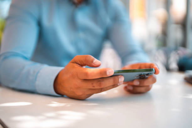 istock Businessman Using A Smart Phone To Surf The Net 1411083639