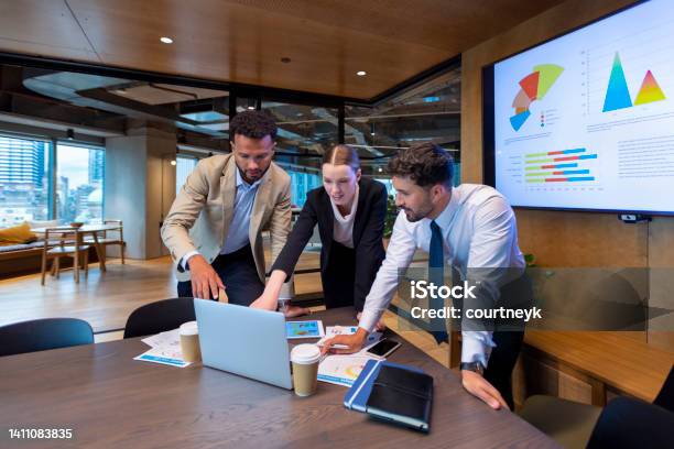 Business People Working On A Laptop Computer In A Modern Office Stock Photo - Download Image Now