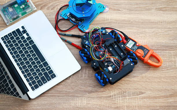 istock Top view of Robot KIT, Multimeter , Control board and laptop using to lean science and technology class 1411085573