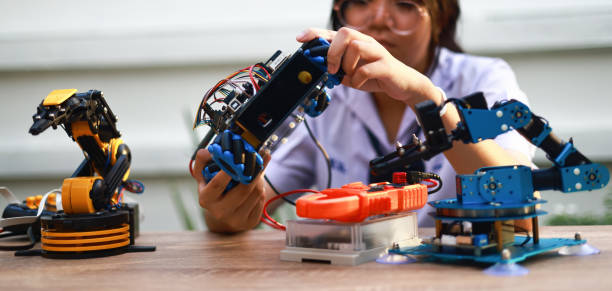 istock Young Asia girl leaning Robot KIT at home after school, Science and Technology learning concept 1411085586