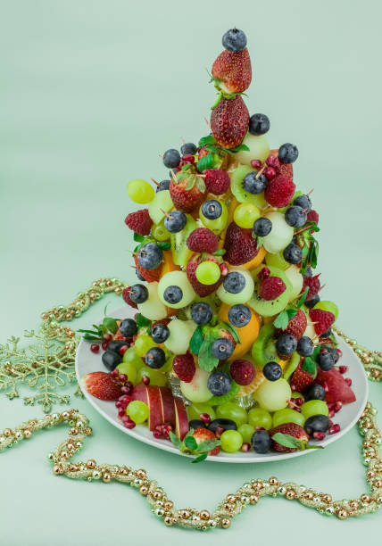 istock Fresh mixed fruits christmas tree shape 1411088674