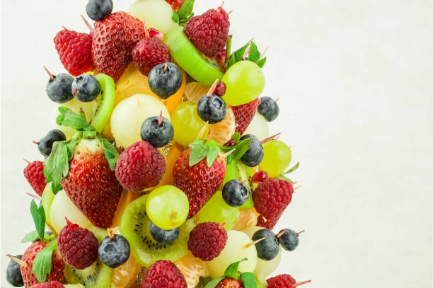 istock Fresh mixed fruits christmas tree shape 1411088700