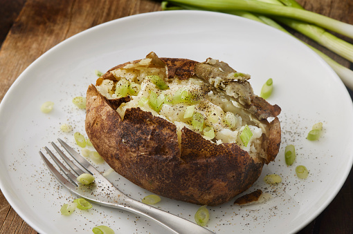 Baked Potato with Melted Butter and Green Onions