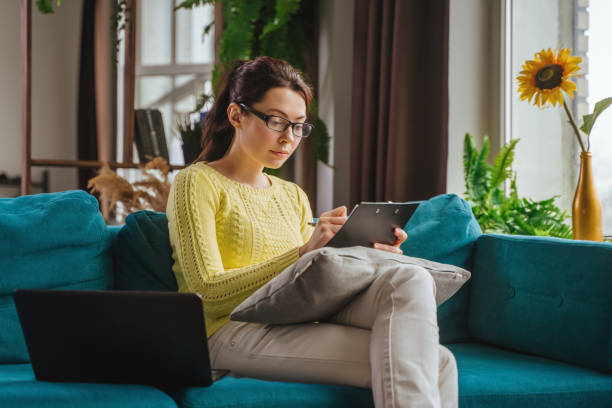 istock Businesswoman typing an e-mail on laptop at home office. 1411091381