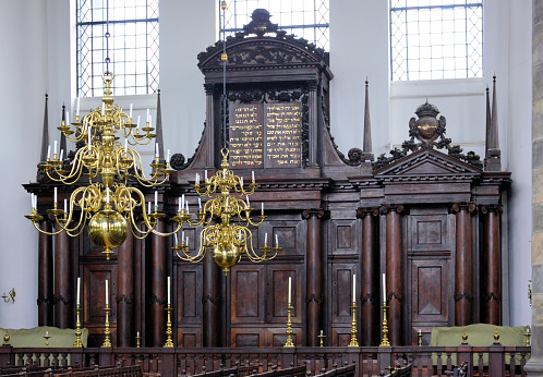 Amsterdam, The Netherlands: Portuguese Synagogue (the Esnoga) - an active Sephardic temple, built in the 17th-century - the Torah ark (Heikhal, or Aron Kodesh), with two tablets with the Ten Commandments engraved in Hebrew letters coated with gold - brass chandeliers with candles illuminate the temple.