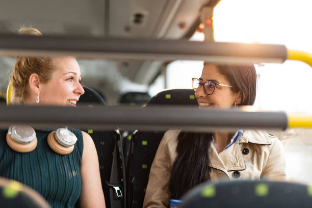 istock Women sitting and talking in bus 1411092025