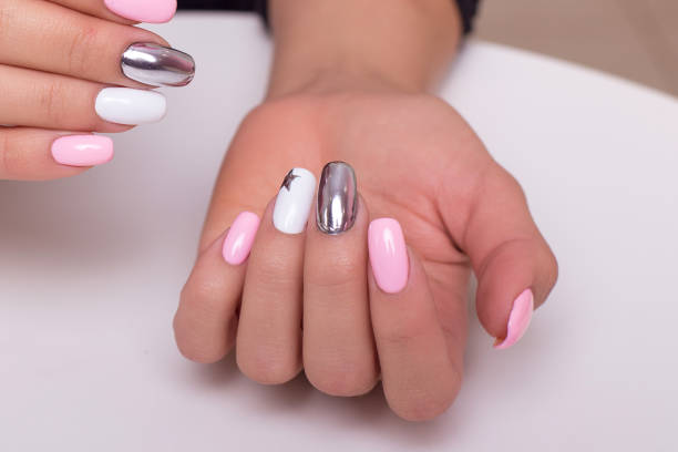 istock Female hands with colourful manicure nails 1411092241