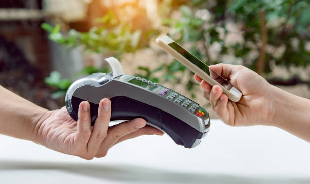 istock Contactless payment by smartphone. Payment with NFC technology 1411095180