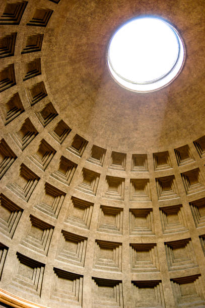 Pantheon Dome in Rome, Italy as the light shines through the oculus a central opening in the roof. stock photo