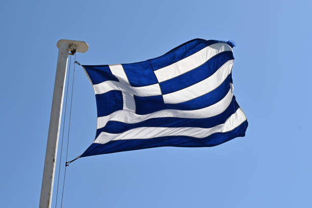 istock Greek national flag against a blue sky 1411096267