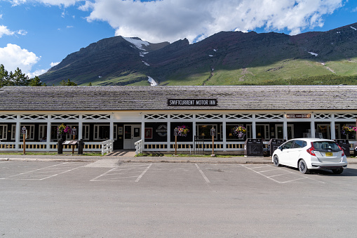 Glacier National Park, Montana - July 2, 2022: Exterior of the Swiftcurrent Motor Inn, a motel inside of the National Park