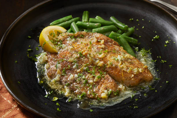 istock Baked Tilapia in a Lemon, Garlic and Butter Sauce 1411098875